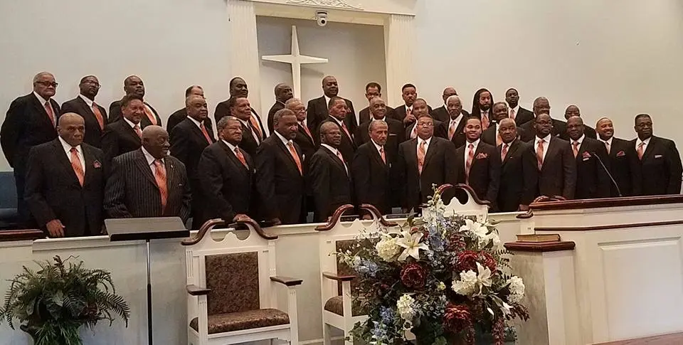 A large group of men posing for a picture